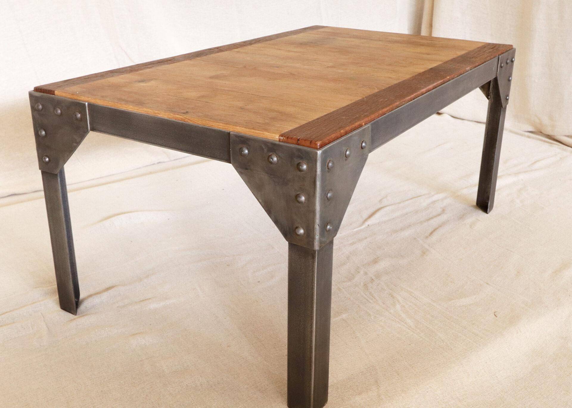 Metal frame coffee table with a reclaimed oak and teak top