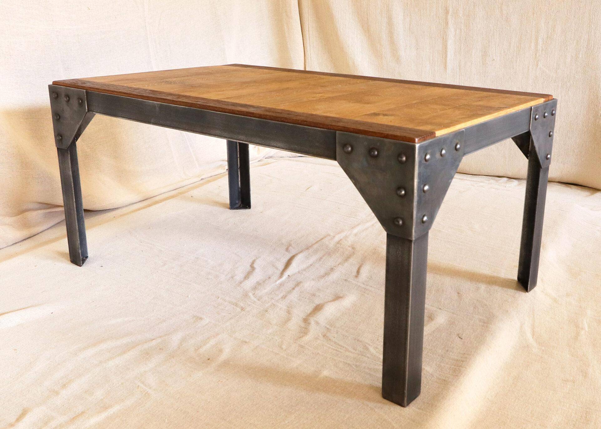 Metal frame coffee table with a reclaimed oak and teak top