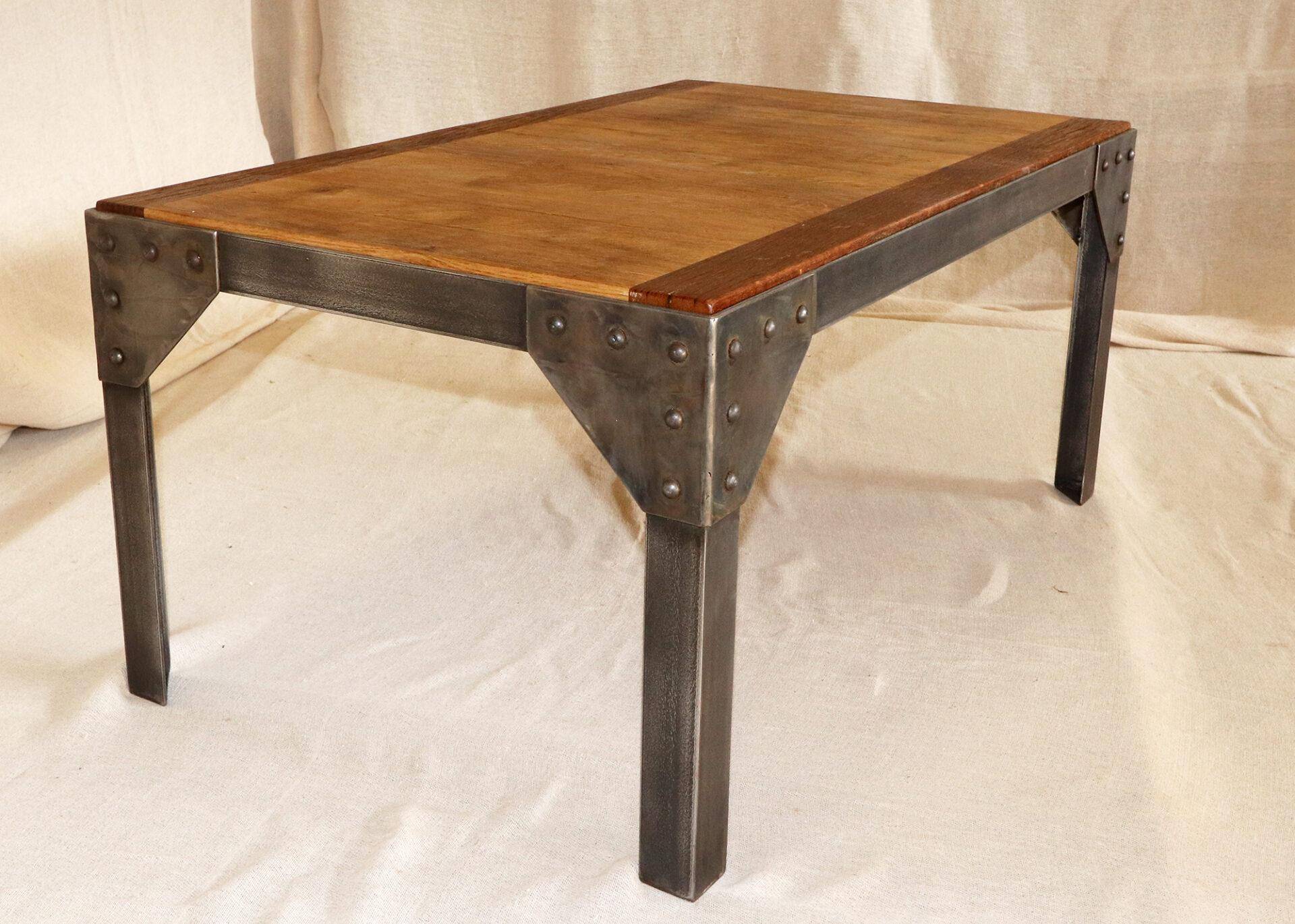Metal frame coffee table with a reclaimed oak and teak top